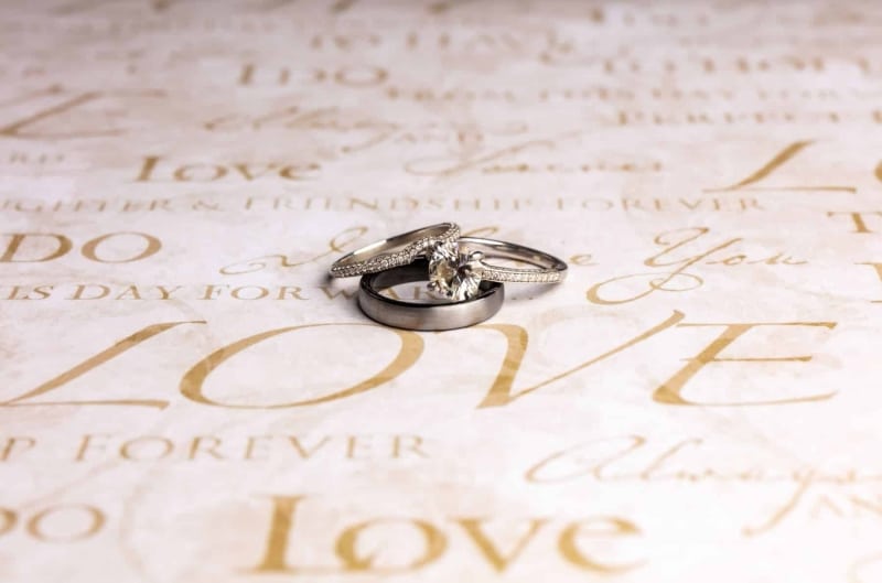 wedding-rings-with-love-written-on-paper