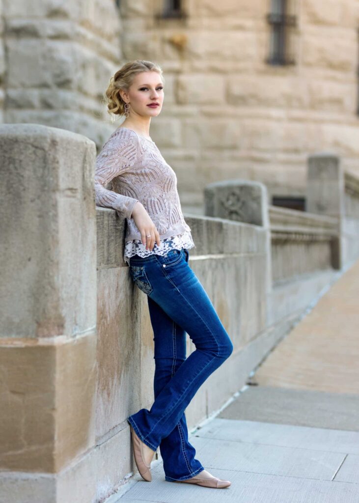 Amber's senior photo, leaning with her back on a wall