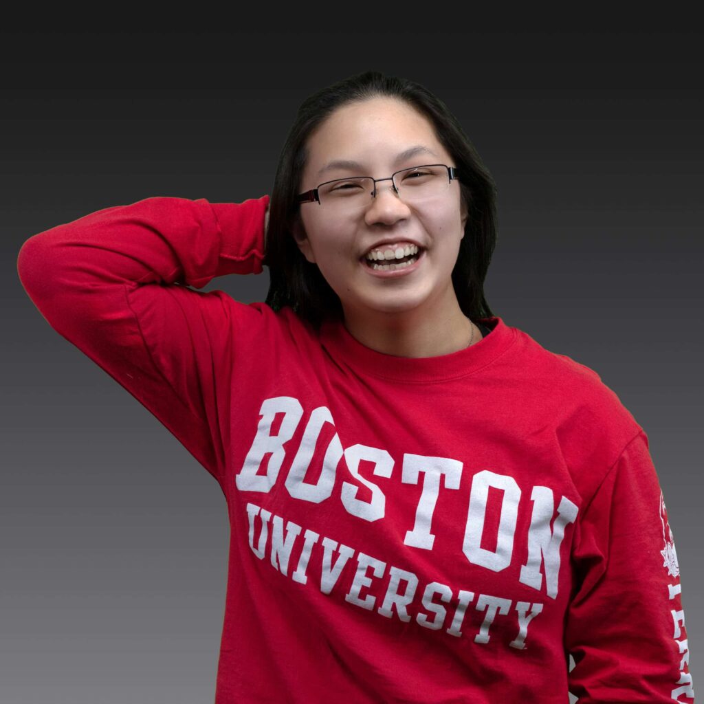 Senior photo of Erika holding her hair behind her back